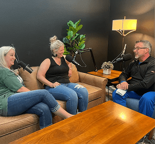Three people recording a podcast